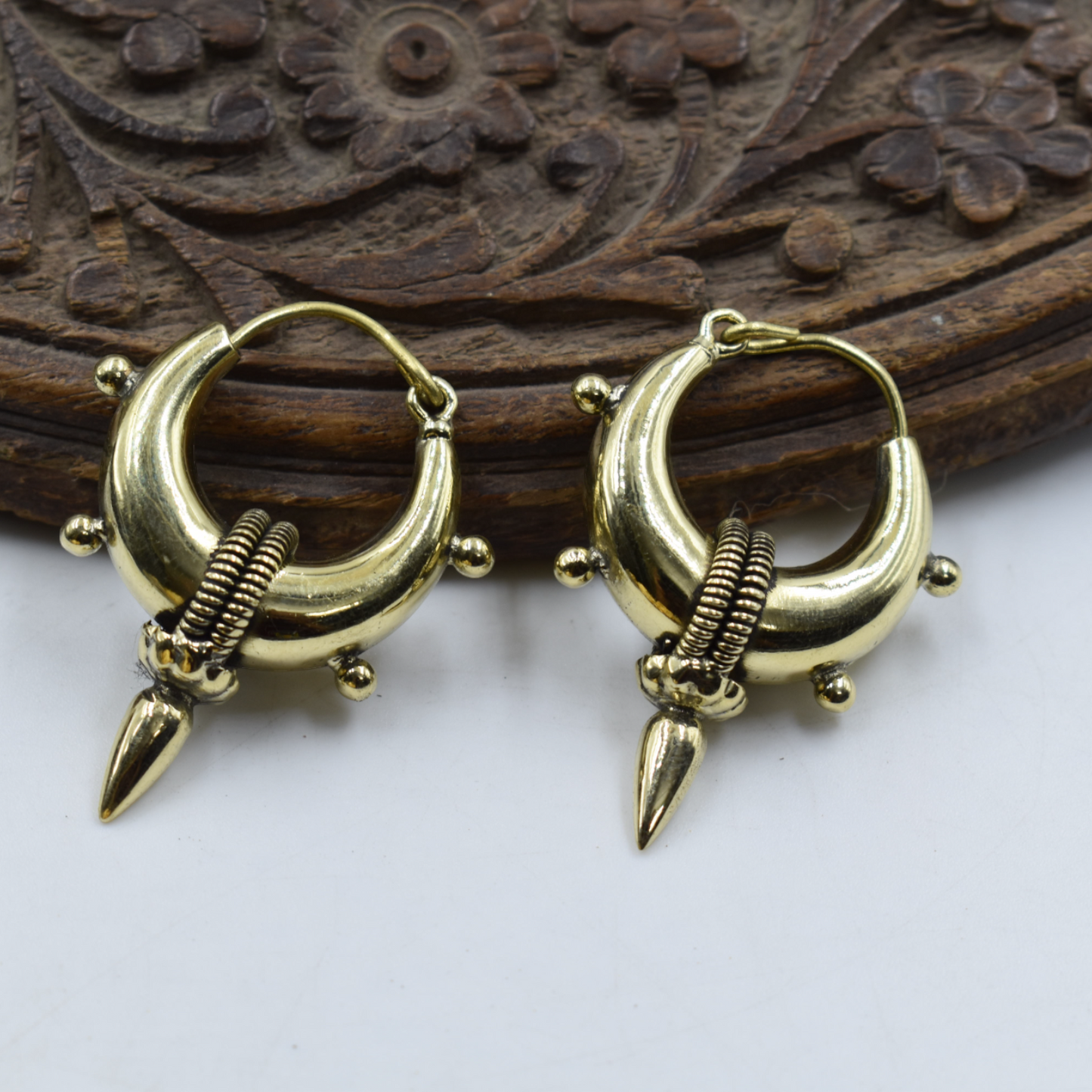 A pair of golden brass hoop earing