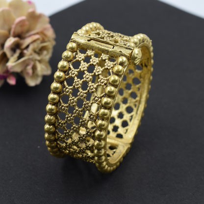 A pair of brass gold openable bangle