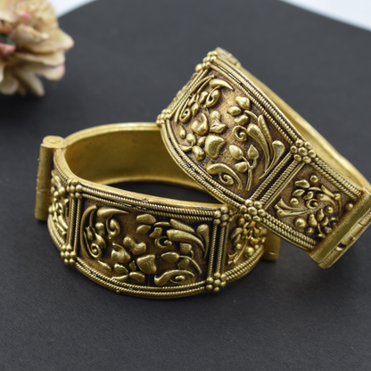 A pair of brass gold openable bangle