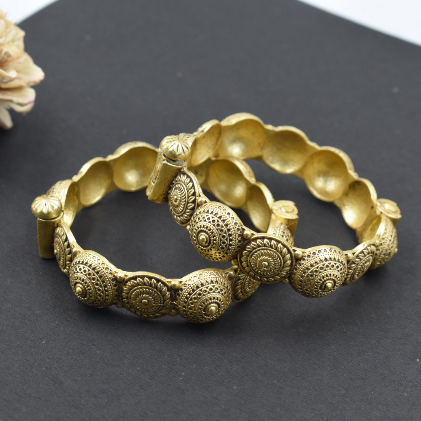 A pair of brass gold openable bangle