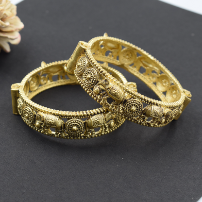 A pair of brass gold openable bangle