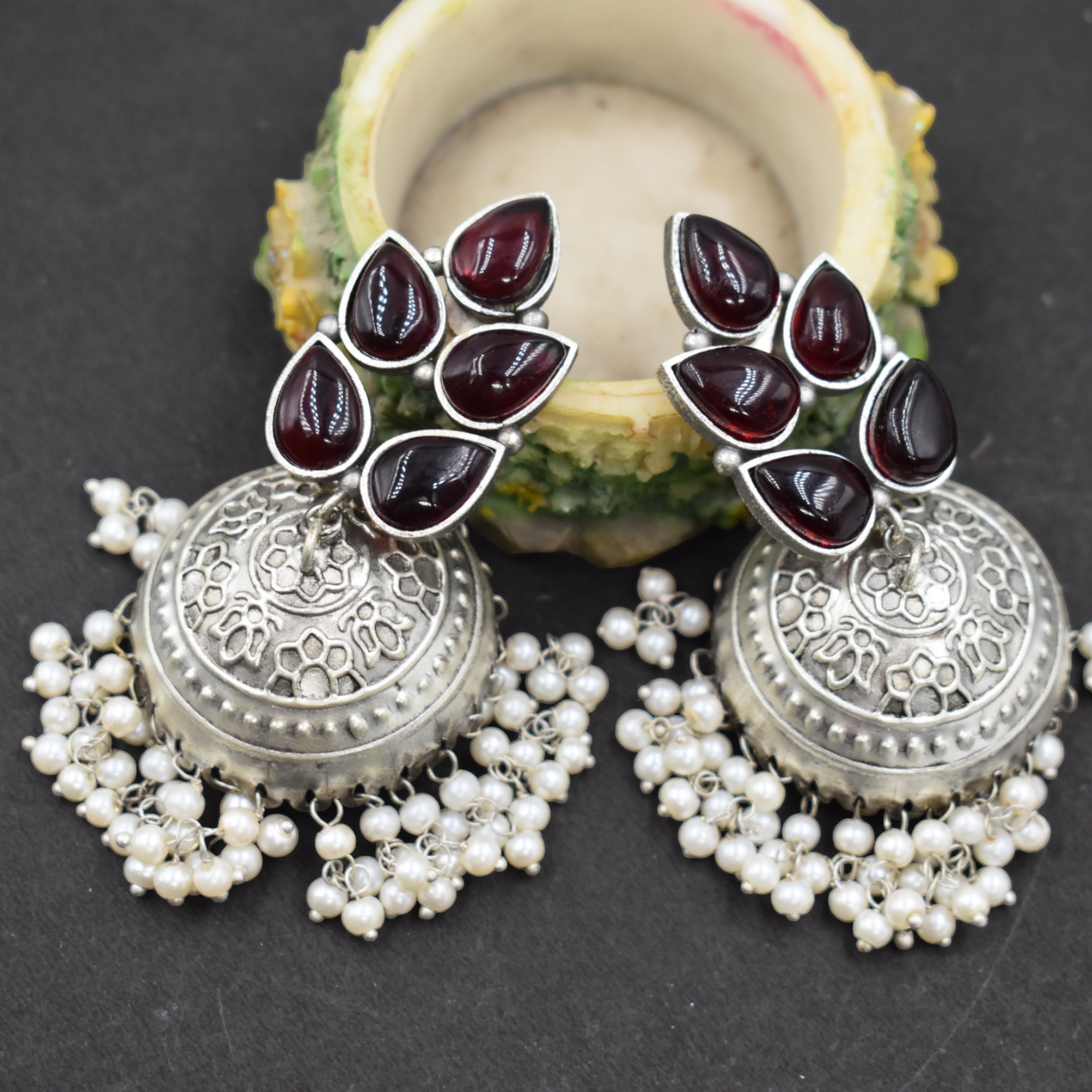 Silver look alike brass stone jhumka earing